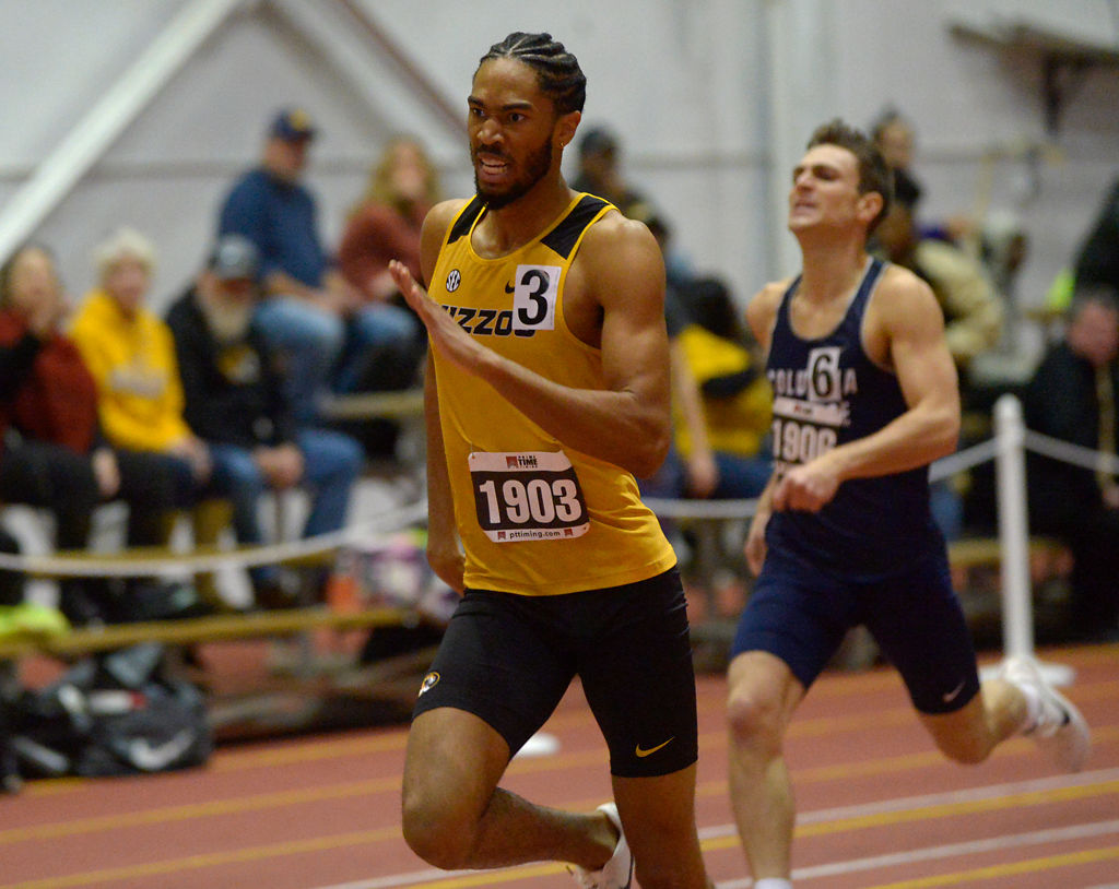 Cason Suggs runs in the men's 600 meter race Friday, Dec. 6, 2019 at Hearnes Field-house
